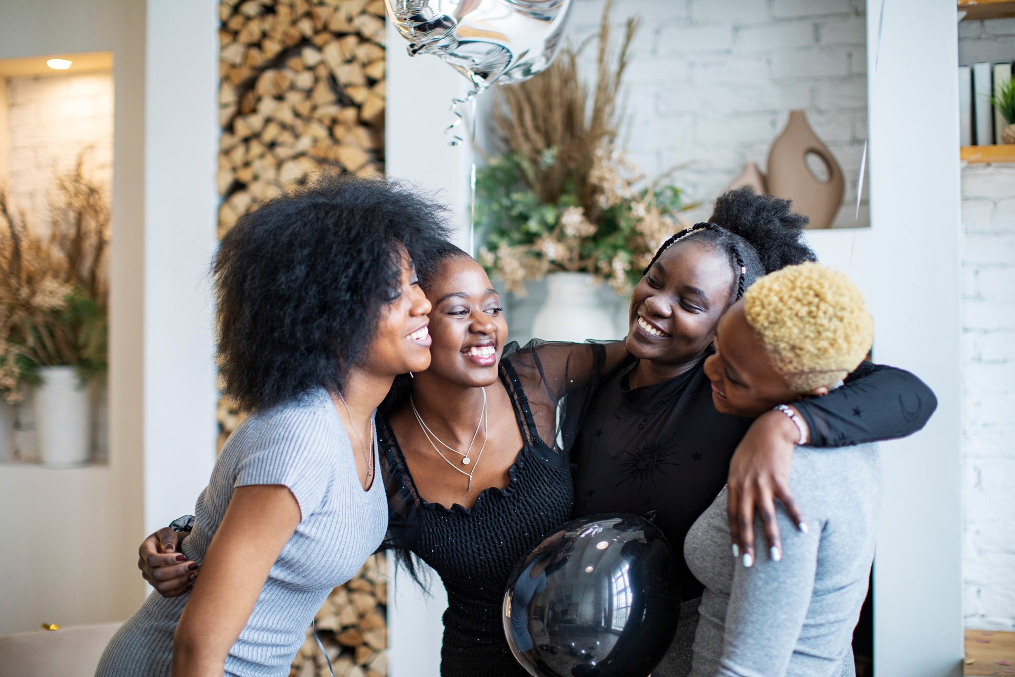 Young Black women having birthday party